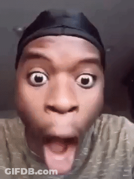 A Man Wearing A Hat Is Making A Funny Face With His Tongue Hanging Out . GIF