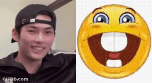 A Man Wearing A Hat Is Next To A Smiley Face GIF