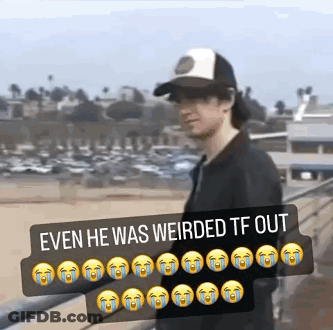 A Man Wearing A Hat Is Standing On A Bridge With A Caption That Says Even He Was Weirded Tf Out . GIF