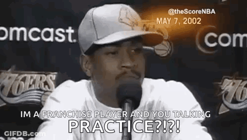 A Man Wearing A Hat Is Talking Into A Microphone And Says `` Im A Franchise Player And You Talking Practice ? '' GIF