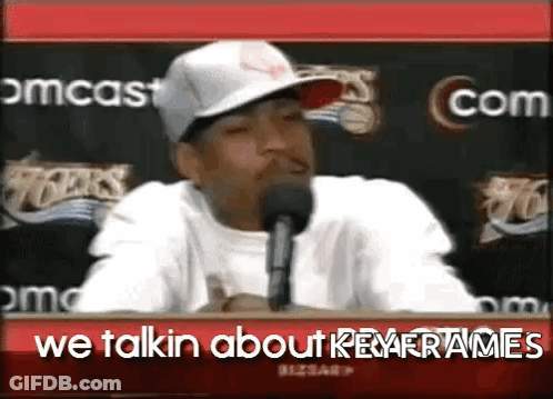 A Man Wearing A Hat Is Talking Into A Microphone With The Words We Talkin About Key Frames Below Him GIF