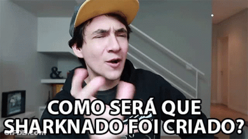 A Man Wearing A Hat Says " Como Sera Que Sharknado Foi Criado " GIF