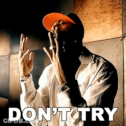 A Man Wearing A Hat Says " Do N't Try " With His Hands In The Air GIF