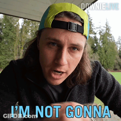 A Man Wearing A Hat Says " I 'M Not Gonna " In Blue GIF