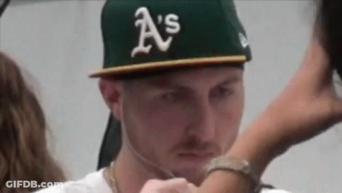 A Man Wearing A Hat That Says A 'S On It . GIF