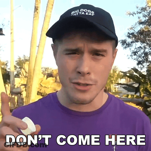 A Man Wearing A Hat That Says Big Dogs Only Eat Holds A Marshmallow And Says " Don 'T Come Here " GIF