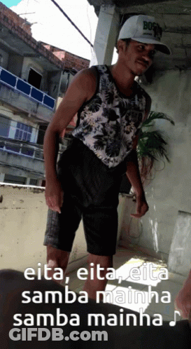 A Man Wearing A Hat That Says Bos On It GIF