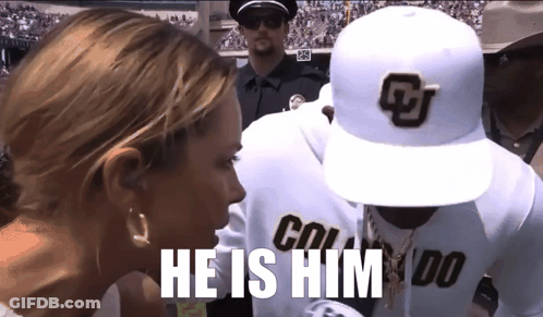 A Man Wearing A Hat That Says Colorado Is Talking To A Woman GIF