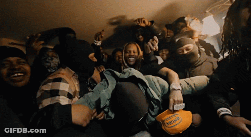 A Man Wearing A Hat That Says ' Dank ' On It Is Surrounded By Other Men GIF