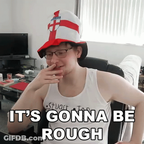 A Man Wearing A Hat That Says England Covering His Nose GIF
