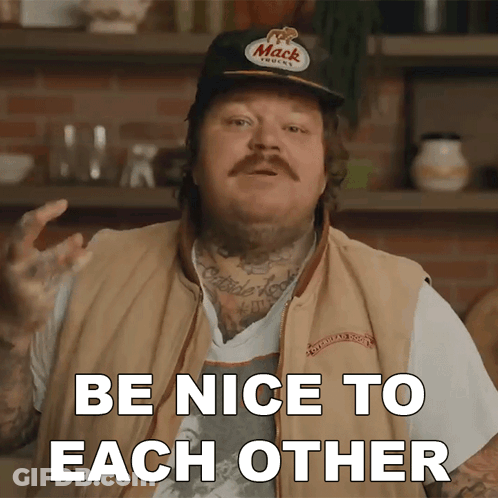 A Man Wearing A Hat That Says Mack On It Says Be Nice To Each Other GIF