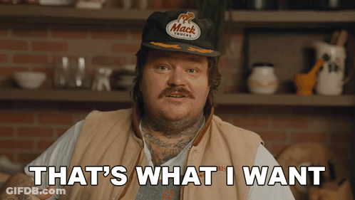 A Man Wearing A Hat That Says Mack Trucks On It GIF