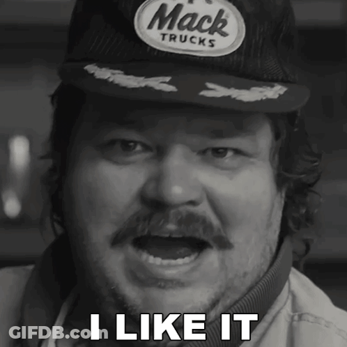 A Man Wearing A Hat That Says Mack Trucks Says I Like It GIF