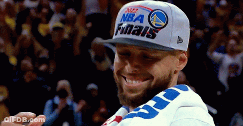 A Man Wearing A Hat That Says Nba Finals Is Smiling GIF