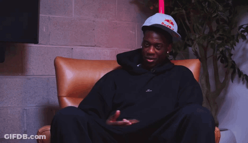 A Man Wearing A Hat That Says Red Bull On It GIF