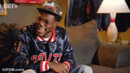 A Man Wearing A Hat That Says South Is Laughing GIF