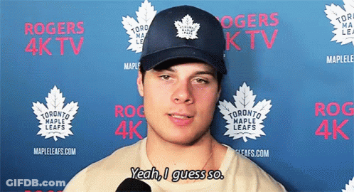 A Man Wearing A Hat That Says Toronto Maple Leafs On It GIF