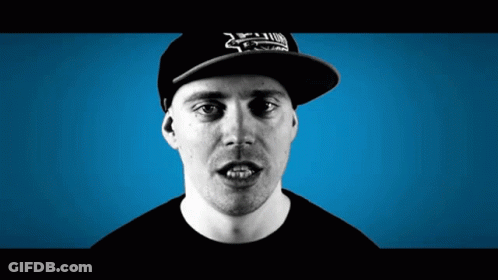 A Man Wearing A Hat That Says ' Xtreme ' On It Looks At The Camera GIF