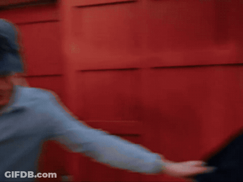A Man Wearing A Hat With A Horse On It Checks His Watch GIF