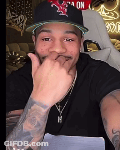 A Man Wearing A Hat With A Star On It GIF