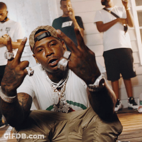 A Man Wearing A Hat With The Letter E7 On It Is Giving The Middle Finger GIF