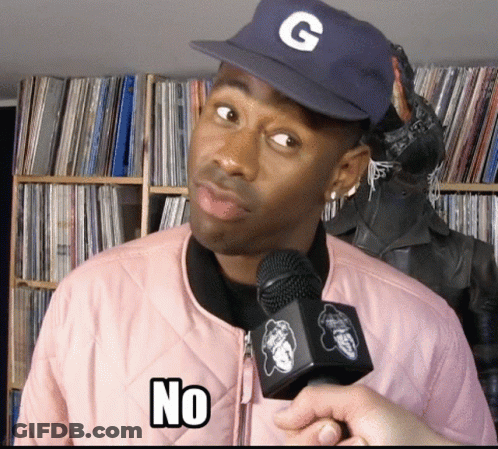A Man Wearing A Hat With The Letter G On It Is Holding A Microphone And Says No GIF