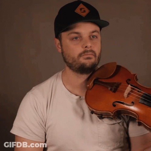 A Man Wearing A Hat With The Letter G On It GIF