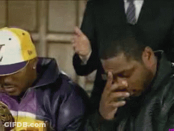 A Man Wearing A Hat With The Letter J On It Sits Next To Another Man GIF
