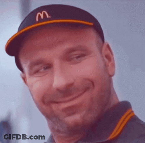 A Man Wearing A Hat With The Letter M On It GIF