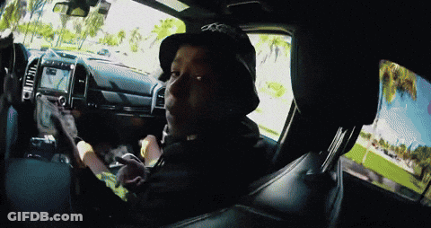 A Man Wearing A Hat With The Letter O On It Is Sitting In A Car GIF