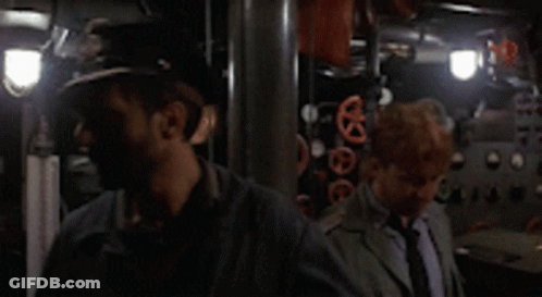 A Man Wearing A Hat With The Letter R On It Is Standing Next To Another Man GIF