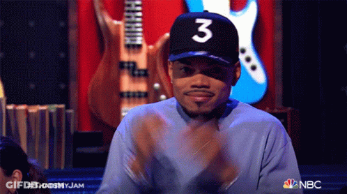 A Man Wearing A Hat With The Number 3 On It Is Clapping GIF