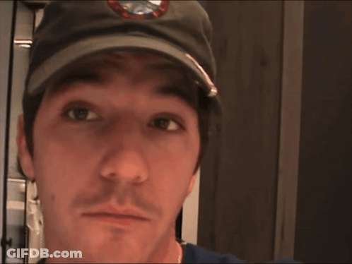 A Man Wearing A Hat With The Word Main On It GIF