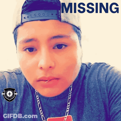 A Man Wearing A Hat With The Word Missing On The Top GIF