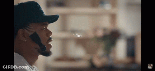 A Man Wearing A Hat With The Word " The " Above Him GIF