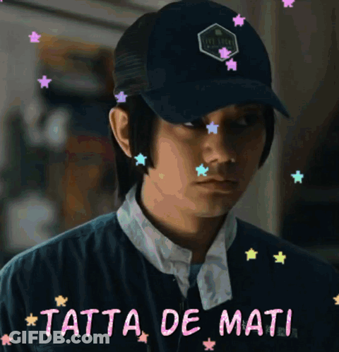 A Man Wearing A Hat With The Words Tatta De Mati On The Bottom GIF