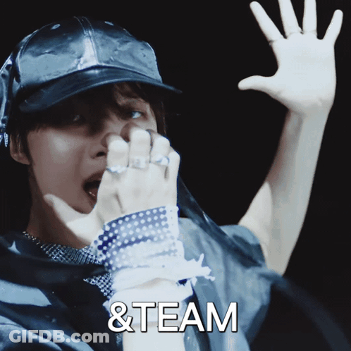 A Man Wearing A Hat With The Words & Team On The Bottom Right GIF
