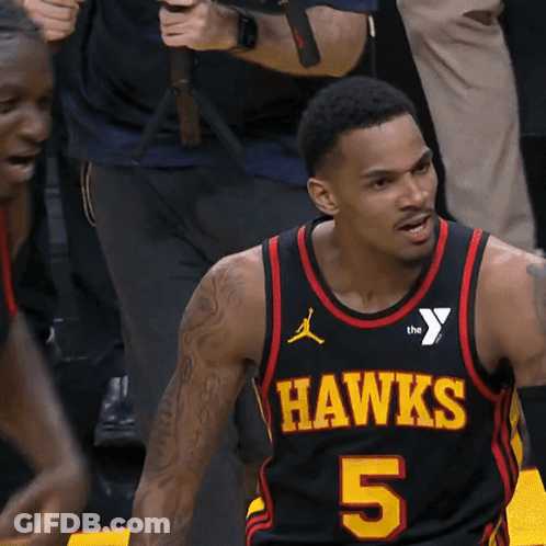 A Man Wearing A Hawks Jersey Number 5 GIF