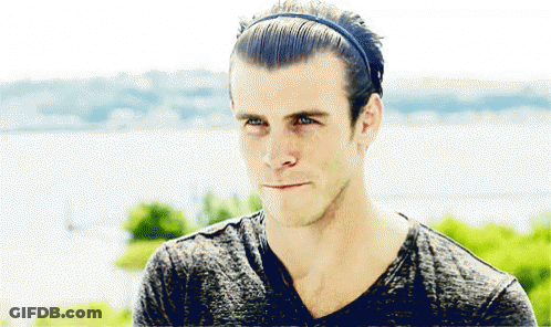 A Man Wearing A Headband And A Gray Shirt GIF