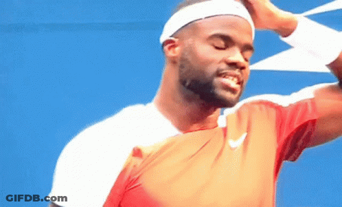 A Man Wearing A Headband And A Nike Shirt Is Smiling With His Eyes Closed GIF