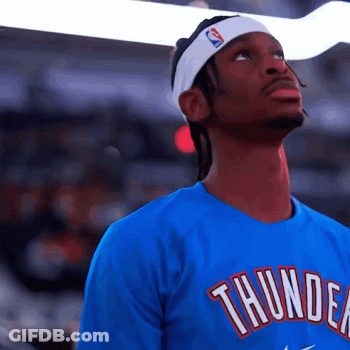 A Man Wearing A Headband And A Thunder Shirt GIF