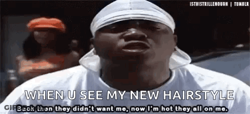 A Man Wearing A Headband And A White Shirt Is Talking About His New Hairstyle . GIF