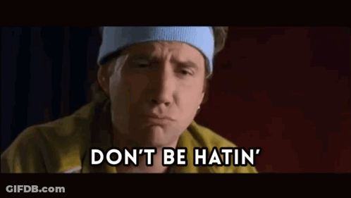 A Man Wearing A Headband And A Yellow Jacket Is Saying " Don 'T Be Hatin " GIF