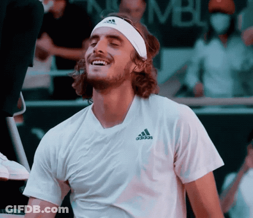 A Man Wearing A Headband And An Adidas Shirt Is Smiling GIF