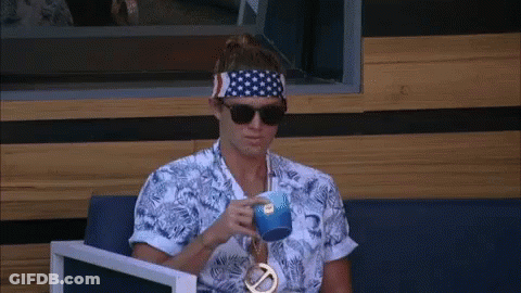 A Man Wearing A Headband And Sunglasses Is Drinking From A Cup GIF