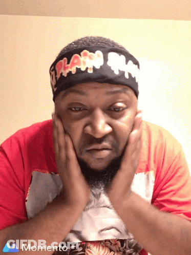 A Man Wearing A Headband That Says Flash On It Holds His Hands To His Face GIF