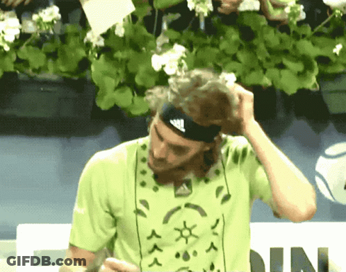 A Man Wearing A Headband With Adidas On It GIF