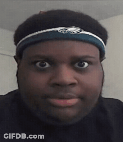 A Man Wearing A Headband With An Eagle On It GIF