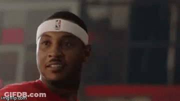 A Man Wearing A Headband With The Nba Logo On It Is Looking At The Camera . GIF