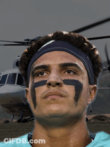 A Man Wearing A Headband With The Number 7 On His Face GIF